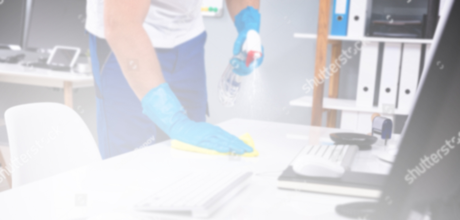 stock-photo-janitor-cleaning-white-desk-in-modern-office-1401013190-edit